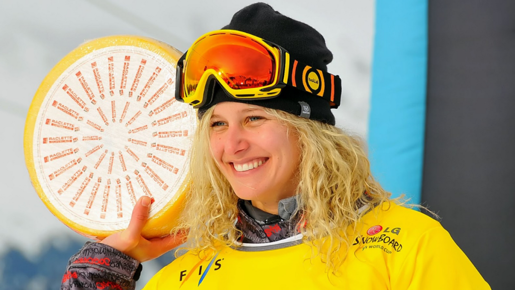 Lindsay Jacobellis, an American athlete, posts on the podium after winning the 2013 world championship at the FIS World Cup Snowboard Cross Finals.