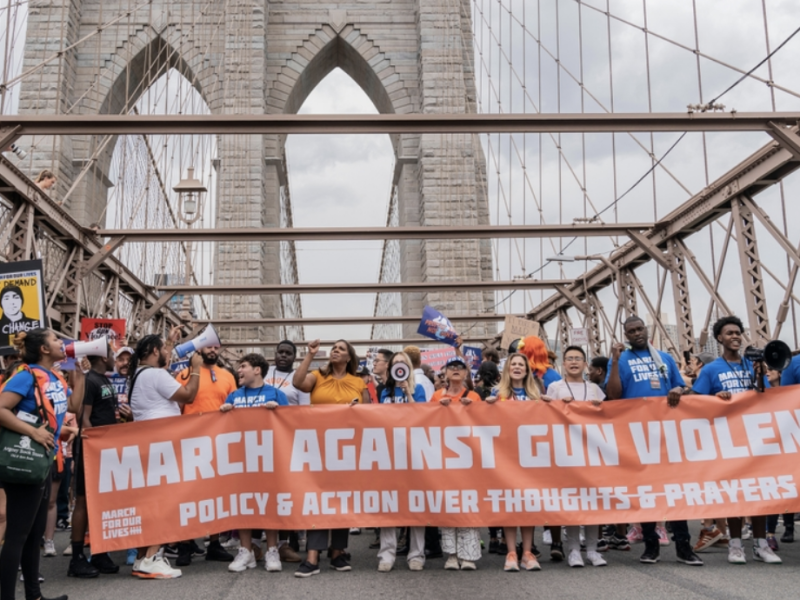 Protesters in New York carry a sign reading "March Against Gun Violence"